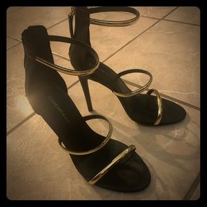 Bebe Black and Gold Pumps